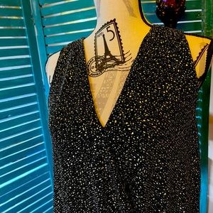 Ladies sleeveless cocktail blouse.